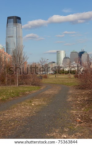 March 2011. Manhattan, lower New York financial offices(downtown) over Hudson river panorama from Liberty State Park(Jersey city). One World Trade Center building under construction