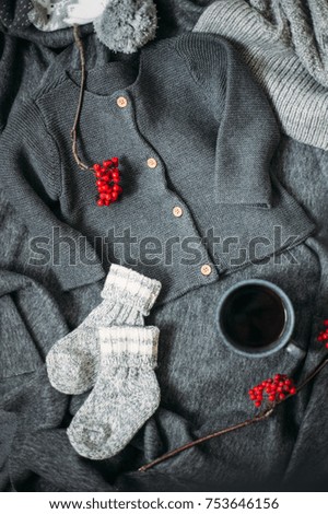 Flat-lay of Autumn or Fall morning coffee with warm clothes