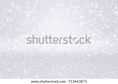 Elegant silver white glitter sparkle confetti background for happy birthday party invite, Christmas card, frosty icy winter snow fall, snowfall frost, glitzy diamond, 25 anniversary or wedding texture Royalty-Free Stock Photo #753663871