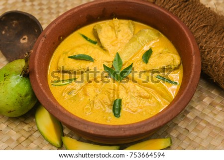 Fish Moilee or Molee, Mappas King fish curry with coconut milk cream. mild spicy seafood cuisine Kerala, India. Rice and fish is a popular delicious recipe in the Indian coastal area restaurants.