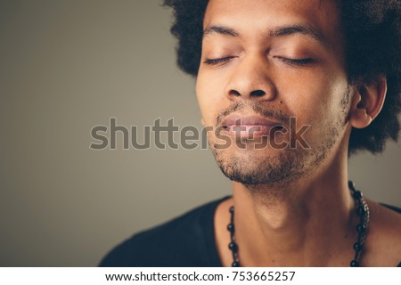 Portrait handsome young man, eyes closed. Stress relief techniques concept take deep breath. Positive human emotions, facial expression sign, feeling Royalty-Free Stock Photo #753665257