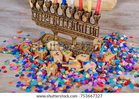 Jewish holiday, Holiday symbol Hanukkah Image of jewish holiday Hanukkah with wooden dreidel spinning top on the glitter background