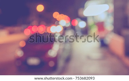Image of Abstract Blur Street night market with bokeh for background usage .(vintage tone)