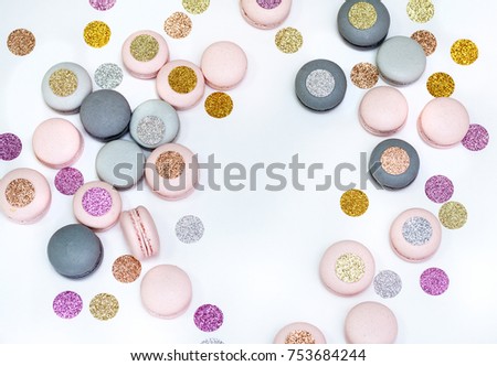 Holiday macarons cookies with sparkling decoration. White background. 
