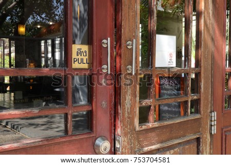 wooden door of a coffee shop