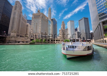 Chicago downtown and Chicago River with tourit ship during sunny day, Illinois, USA. 