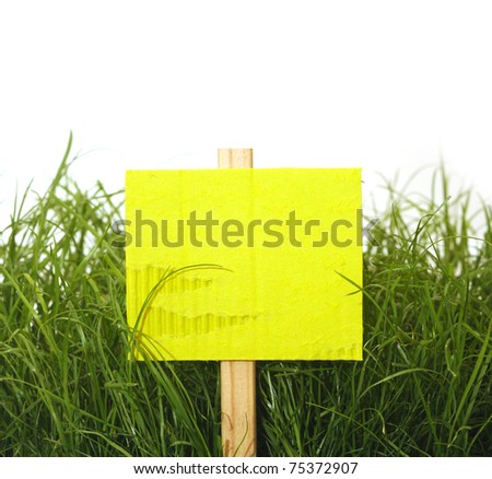 cardboard sign with grass isolated on white