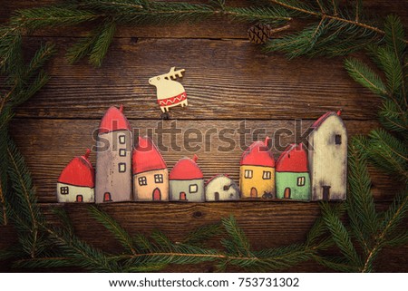 Small wooden handmade toy houses as Christmas decorations