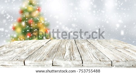 Christmas background with Christmas tree in gray color. Snowflakes and frost. desk with space for your product.
