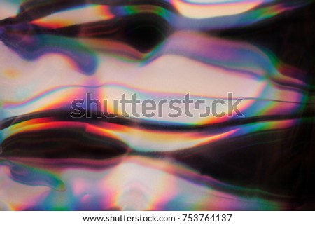 Abstract smooth rainbow chrome background with copy space.