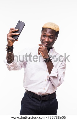 young man taking a selfie with a cell phone, isolated on white
