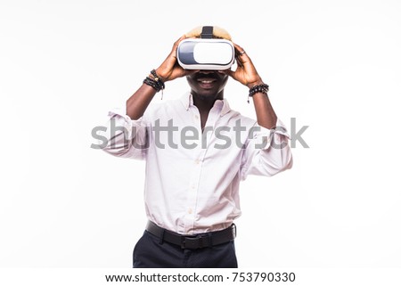 Portrait of an African American young man in a hoodie wearing vr glasses and playing a video game.