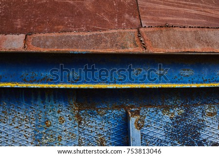 corrugated metal with spots and rust