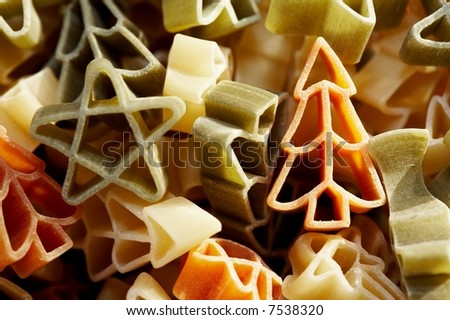 Colourfull christmas decorations- stars and trees made from pasta in close up.