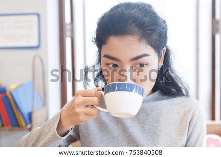 asian woman drink coffee in coffee shop