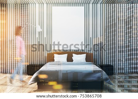 Wooden bedroom interior with a white wooden floor, a double bed with a poster hanging above it and two bedside tables. A woman 3d rendering mock up double exposure toned image