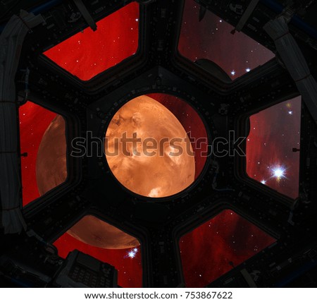 Mars in window of spaceship. Elements of this image furnished by NASA.
