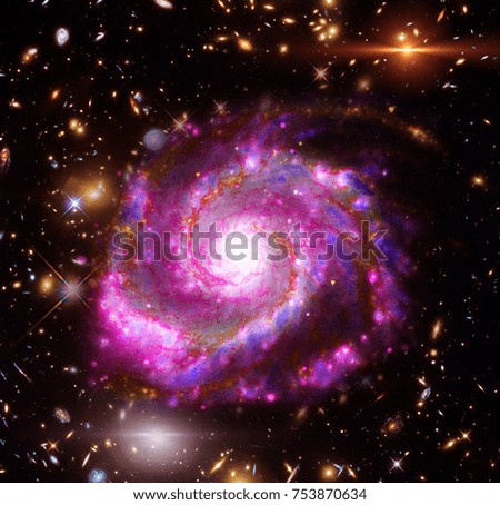 Star cluster and galaxy. The elements of this image furnished by NASA.
