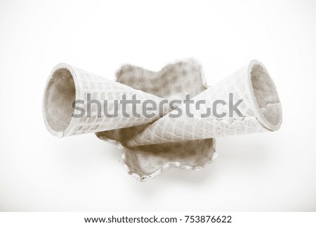 Empty sugar waffle cones for the ice cream isolated on white background. Toned.