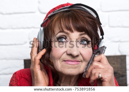 Audio book and new technology, education. music and radio operator. Granny dj in headset. Spy and telephonnist. Old woman listen music in headphones.