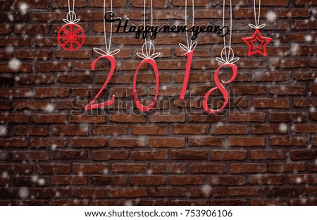 Text Massage "New Year 2018" hanging sign on old grunge brick wall background with snow fall - can used for display or montage your products.