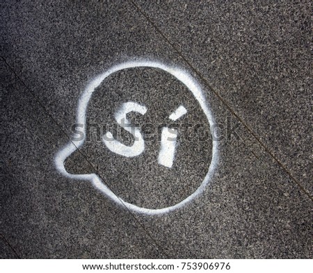 Word Yes in circle drawn on pavement. Catalonia says Yes to secession from Spain plebiscite, separatism, sovereignty. Signs and symbols in politics and life