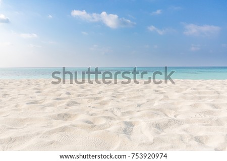 Summer beach background. Sand and sea and sky  Royalty-Free Stock Photo #753920974