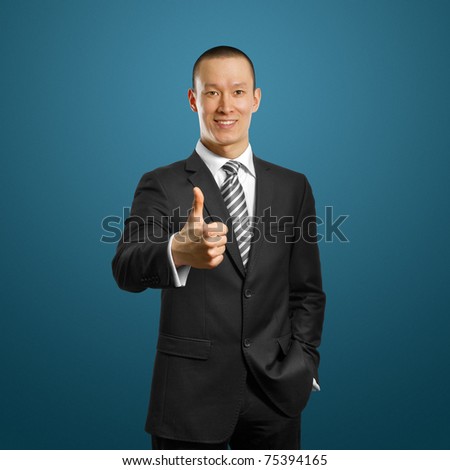 asian businessman in black suit shows well done against different backgrounds