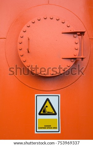 Tank orange confined space entry with warning sign symbol