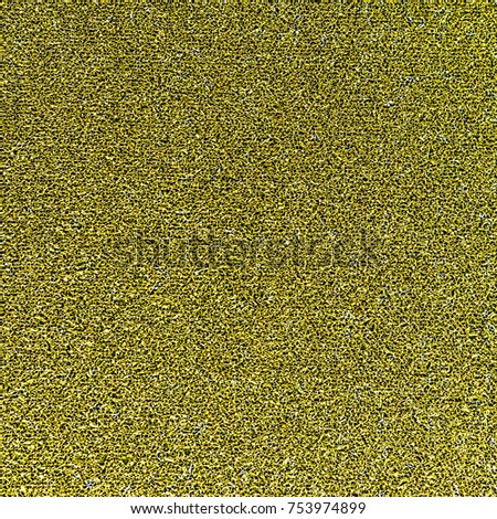 Gold glitter paper texture background, close up photo.