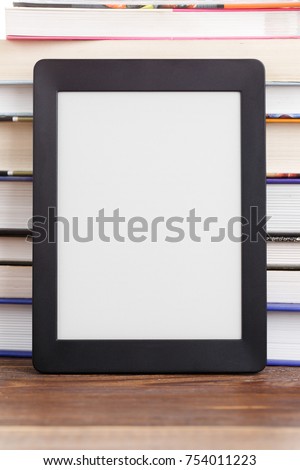 Empty black frame for photography on background of books pile
