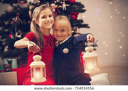 Picture showing happy children posing with Christmas lanterns