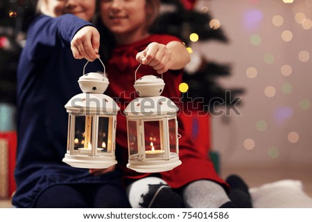 Picture showing happy children posing with Christmas lanterns