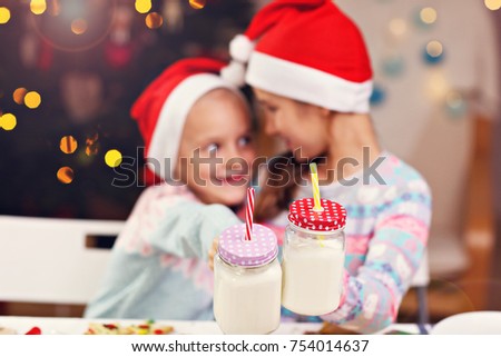 Picture showing joyful kids preparing Christmas biscuits