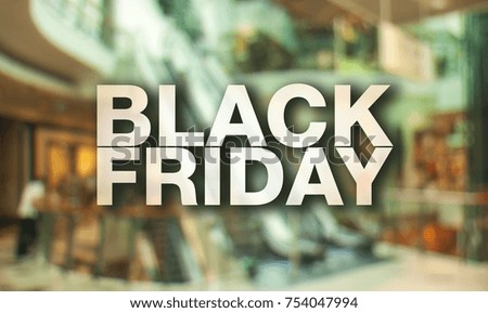 Black friday poster. Blurry shopping mall background.