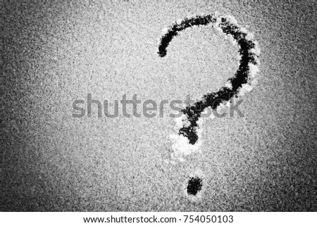 Snow texture with question mark. Picture on the snow surface / pattern on winter glass