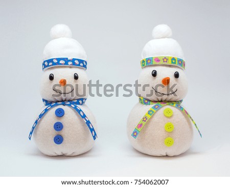 Photo of beautiful snowmans isolated on neutral background