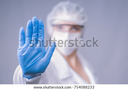 Great concept of infection, contamination, doctor making stop sign with his hand. Coronavirus, COVID-19. Royalty-Free Stock Photo #754088233