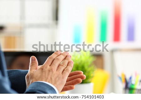 Man in suit clap his arms congrats for successful seminar in office closeup. Thank symbol great lecture job emotion worker introduce colleague negotiation happy birthday win career project idea