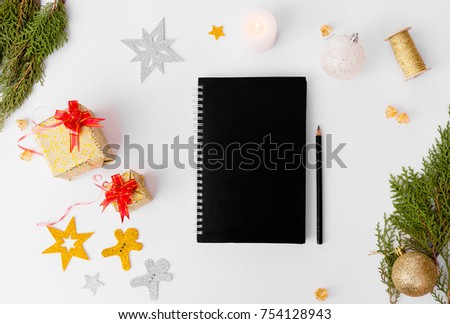 diary notebook stylish mock up for christmas time. christmas tree, cones and decorations on white background.