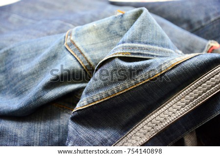 . Old grunge vintage denim jeans fashion design. Dark edged.Detail. shallow dof