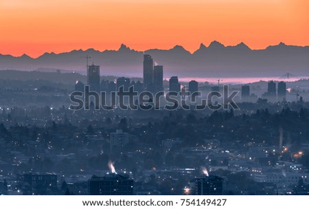 Colourful Vancouver Sunset Fog with Buildings and Mountains