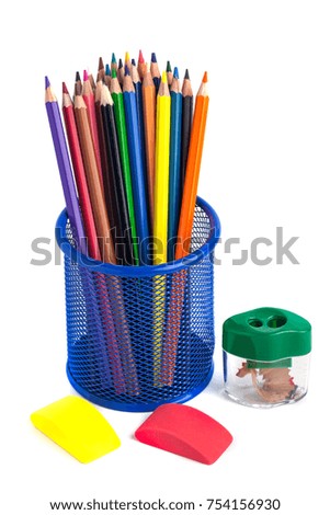 colored pencils in the basket, Eraser and pencil sharpener on white background.