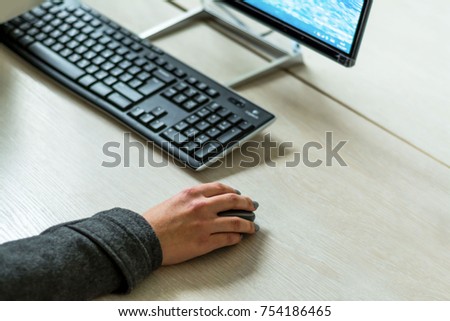 A person works on a computer in the office