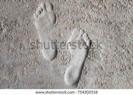 Footprints on the sand.Walking along the sea coast.