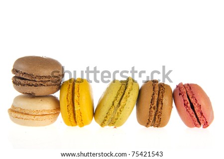 Colorful French macarons isolated over white background