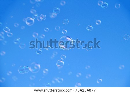 Soap bubbles floating up into the sky. There is nothing more magical to a child, and many adults, than a cloud of shimmering bubbles floating up towards the sky