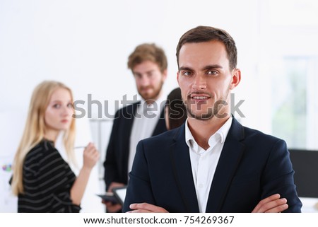 Handsome man in suit and tie look in camera hands crossed on chest background. White collar dress code modern office lifestyle graduate college study profession idea coach train concept