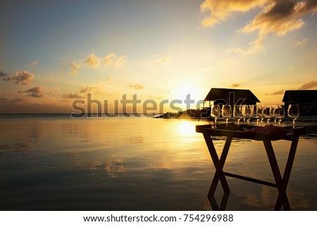Sunset in a luxury resort on the beach. Maldives life style