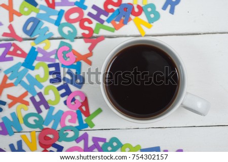 alphabet  wooden and coffee on wood background